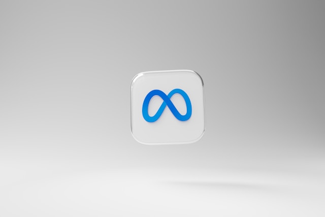 A floating 3D icon of the Meta logo